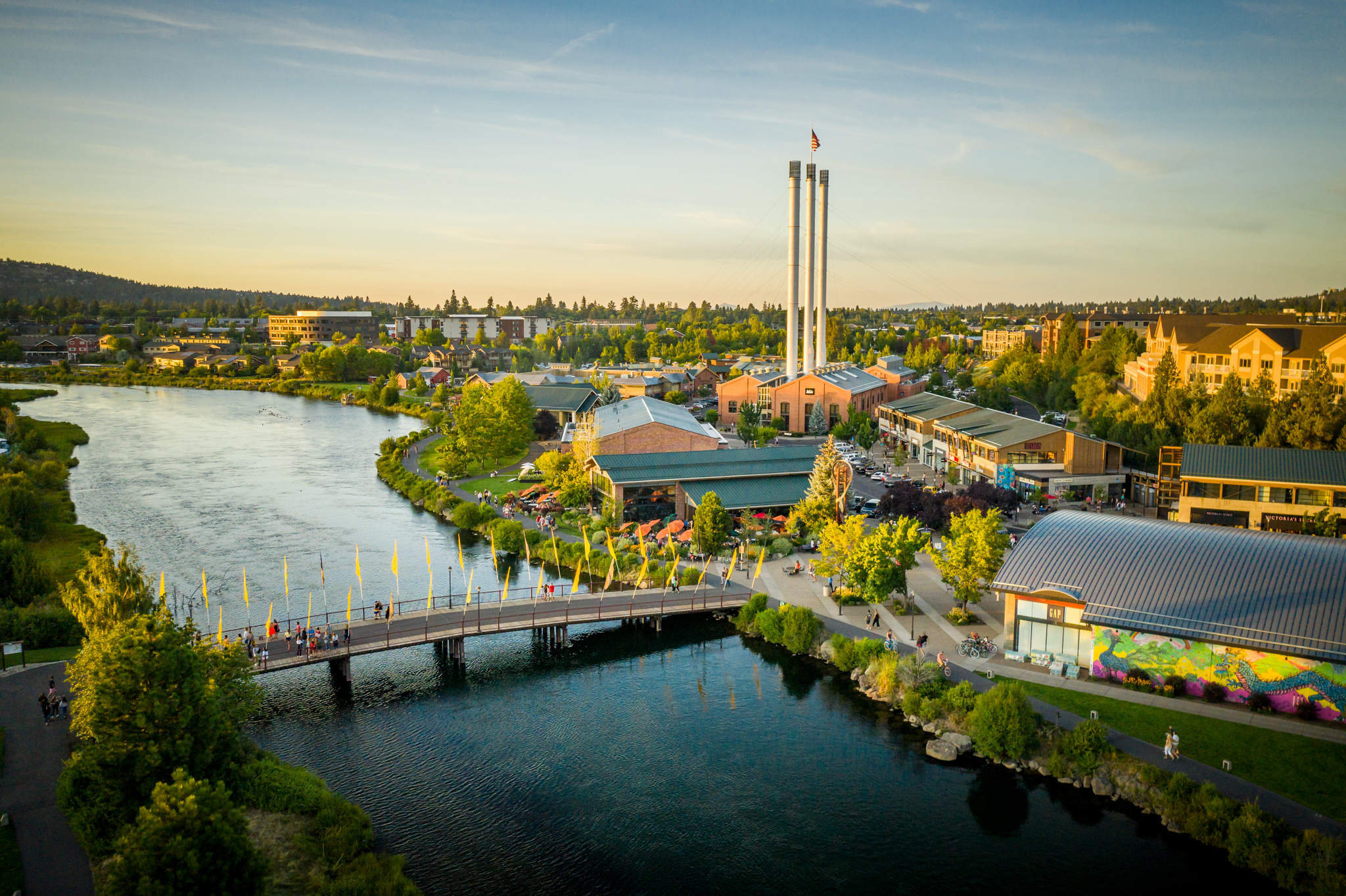Colorful summer view across Bend’s Old Mill District and Deschutes River