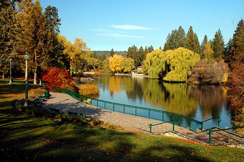 Bright fall colors beside Mirror Pond at Drake Park in Bend