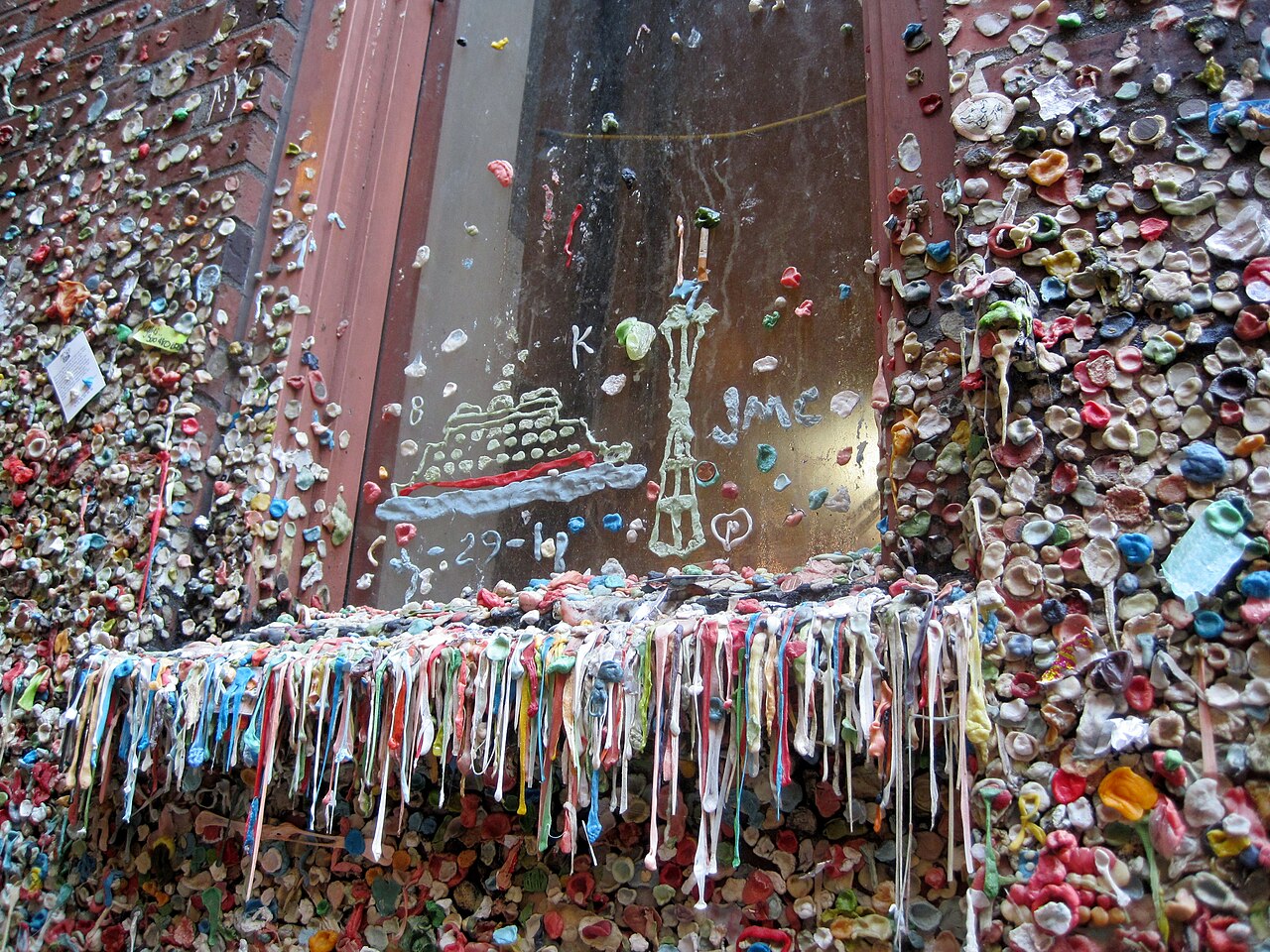 Colorful gum covering a windowsill at Seattle’s Gum Wall