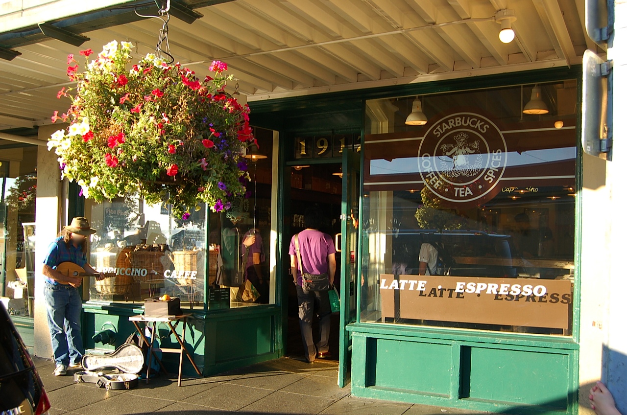 A horizontal view of the original Starbucks storefront at Pike Place Market