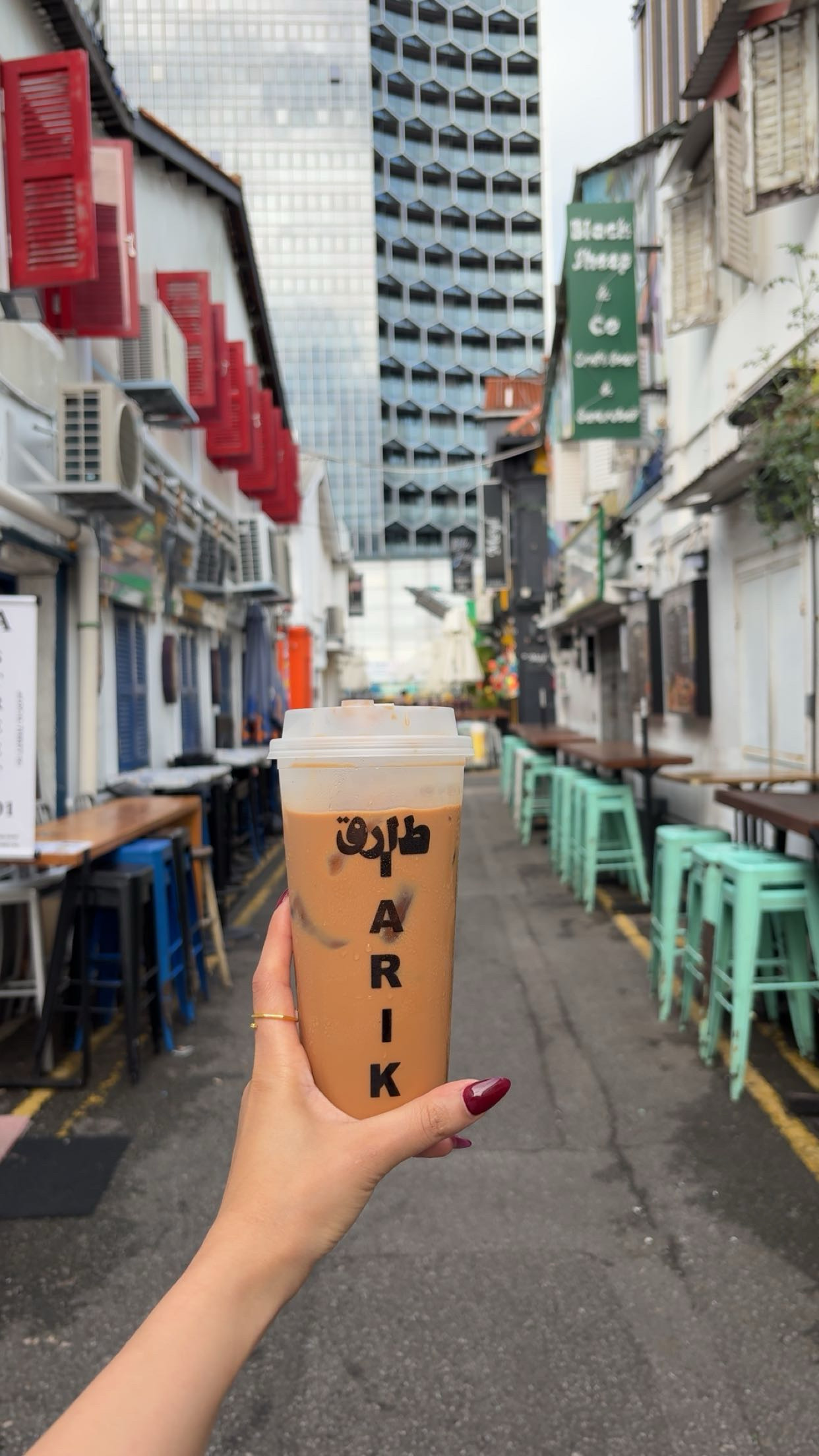 A drink on a colorful Singapore street