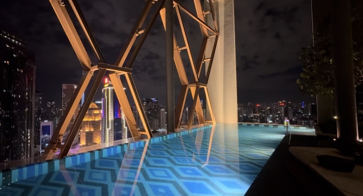 The rooftop pool overlooking Kuala Lumpur at night